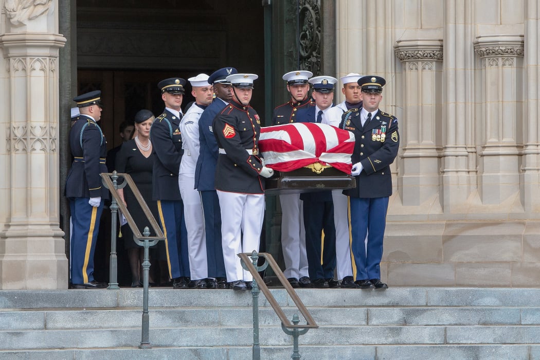 Megan McCain looks on as a Military Honor Guard carrying the casket of late Senator John McCain, Republican of Arizona, exits the National Cathedral after a funeral service at the National Cathedral in Washington, DC.