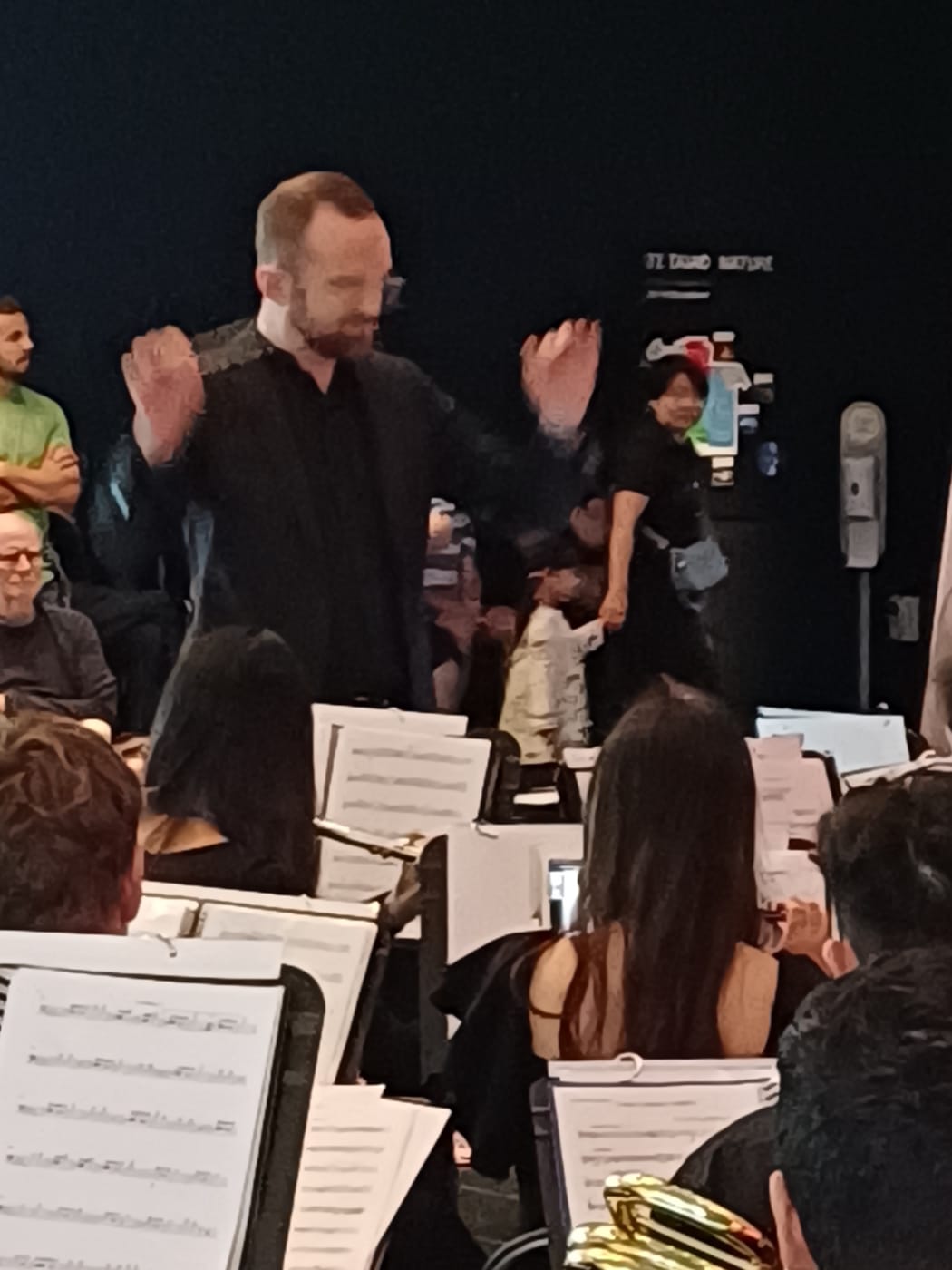 Jono Palmer conducts the New Zealand Youth Symphonic Winds at Te Papa, January 2024.