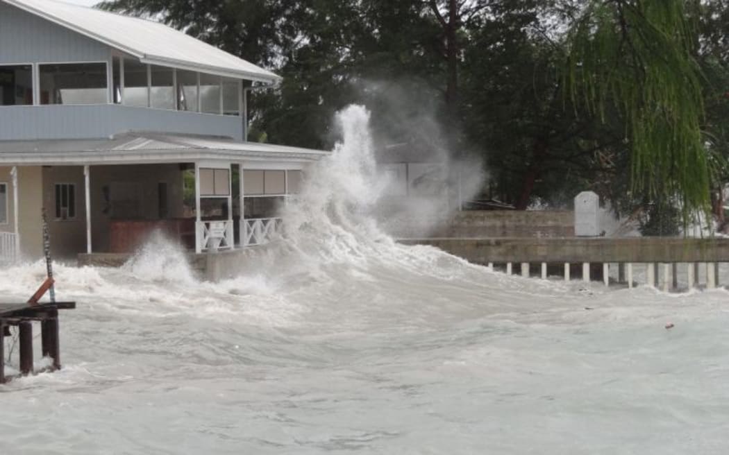A Majuro business' shoreline bar and store is blasted by high waves kicked up by a tropical depression that was building to typhoon strength Friday night in the Marshall Islands. The waves caused major damage to the capital atoll's three-mile downtown lagoon shoreline.