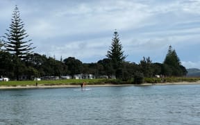 A paddle boarders enjoying Orewa Estuary, north Auckland, as the region starts two weeks in level 3.