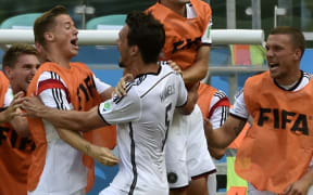 German players celebrate Mats Hummels goal during the Group G football match against Portugal at the Fonte Nova Arena in Salvador.