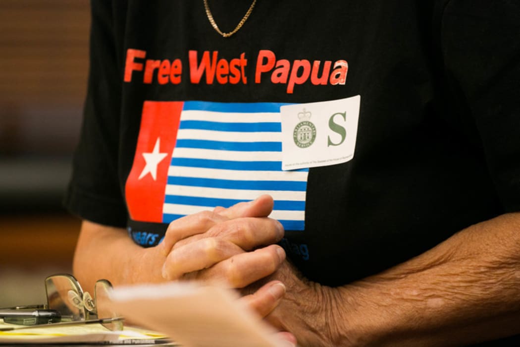 Maire Leadbeater wears a "Free West Papua" shirt as she answers questions on her petition urging the government to address human rights issues in West Papua.