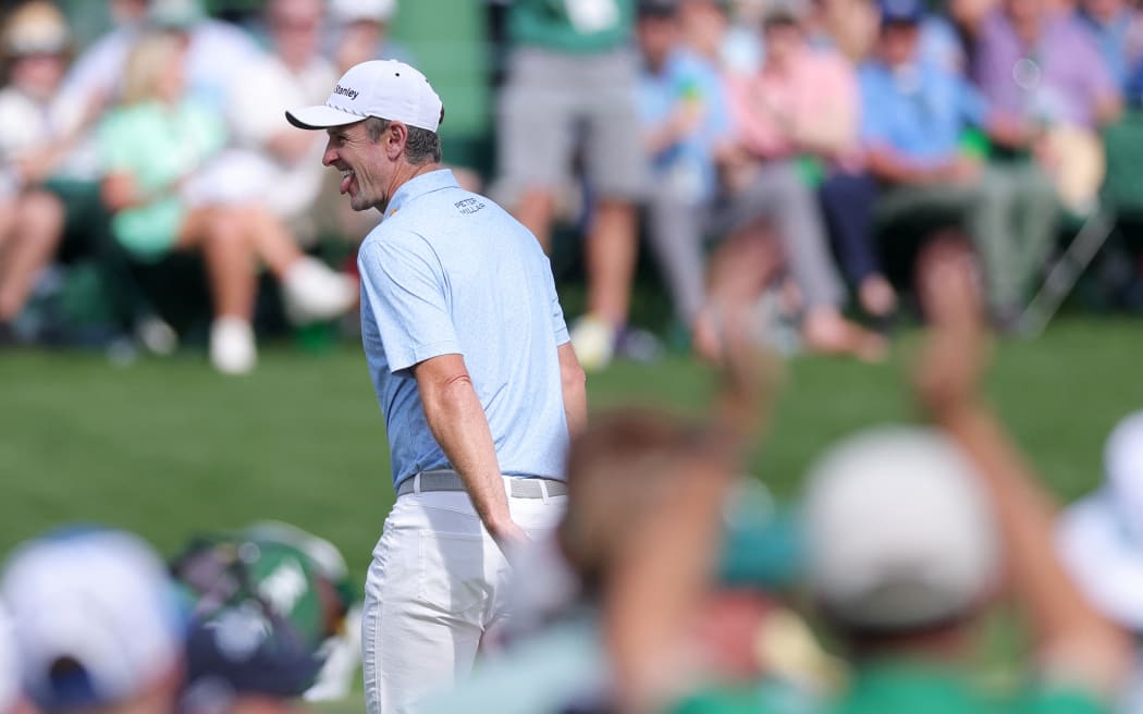 Justin Rose enjoys a birdie putt during the opening round of the Masters tournament at Augusta, Georgia. Rose holds a three-shot lead after the first round, 11 April, 2025.