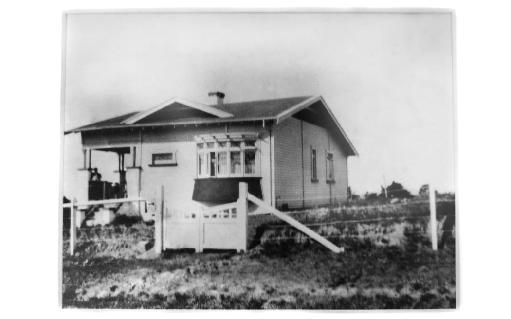 A black and white picture of Ella's family home which was built by her mother's great-grandfather over 100 years ago.