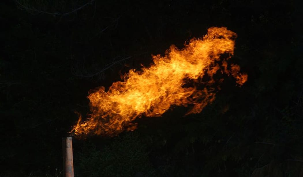 Flare burning off gas and oil at Niagara 1 oil well, West Coast.