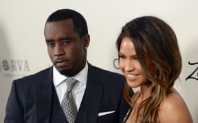 (FILES) Sean P. Diddy Combs with Cassie Ventura attend the premiere of 'The Perfect Match' at the Arclight Theatre in Los Angeles on March 7, 2016. Rapper Sean "Diddy" Combs apologized on May 19, 2024 after surveillance video surfaced showing him physically assaulting his then-girlfriend Casandra Ventura in 2016. Combs is the target of several civil lawsuits that characterize him as a violent sexual predator who used alcohol and drugs to subdue his victims, and his homes were raided this year by federal agents. (Photo by Chris Delmas / AFP)