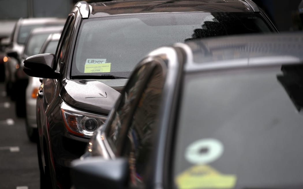 The Uber logo is displayed on a car on March 22, 2019 in San Francisco, California. Uber is piloting a new option for its US app that will allow female passengers to request women drivers, coming after the company has long grappled with preventing sexual assault on its platform.