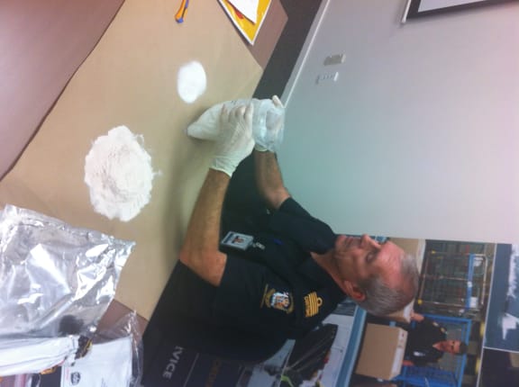 Chief Customs officer Geoffrey Rollinson inspects one of the many packages seized.
