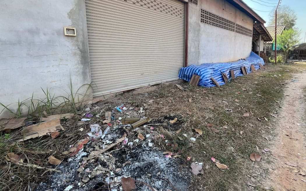 Outside the factory, blue plastic was draped over stacks of bottles and Tiger packaging was seen on the ground.