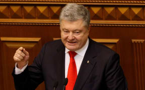 Ukrainian President Petro Poroshenko addresses during an emergency session of Ukrainian Parliament in Kiev, Ukraine, on November 26, 2018.