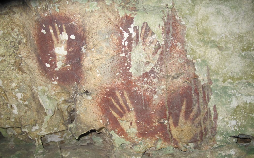 Prehistoric humans have been making distinctive hand shapes in caves in Sulawesi for tens of thousands of years. Pictured here is an undated example from Leang Jarie, Maros, Sulawesi.