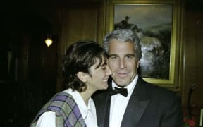 This undated trial evidence image obtained 8 December 2021, from the US District Court for the Southern District of New York shows British socialite Ghislaine Maxwell and US financier Jeffrey Epstein.