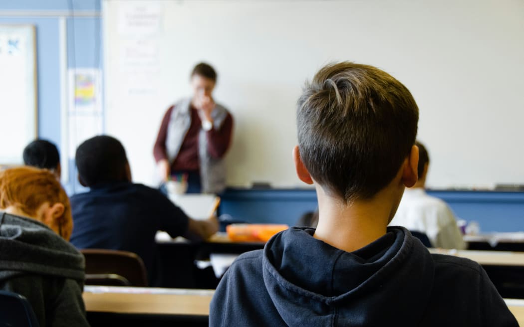 Children in a classroom learning.