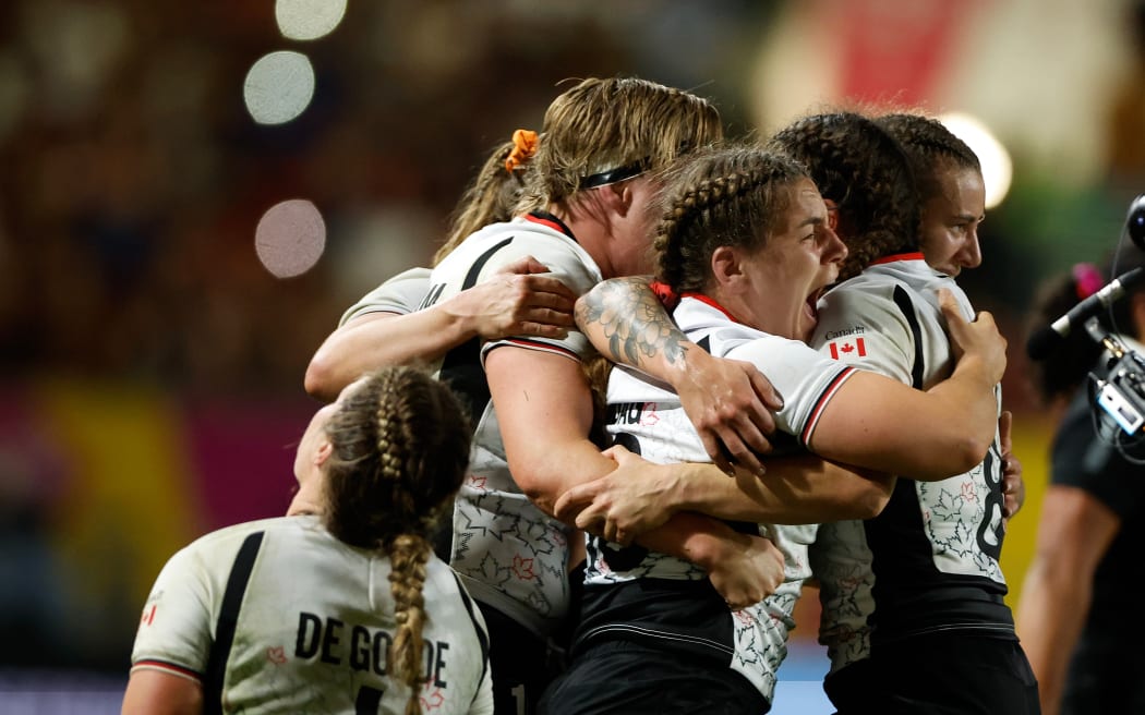 Canada players celebrate victory over the Black Ferns.