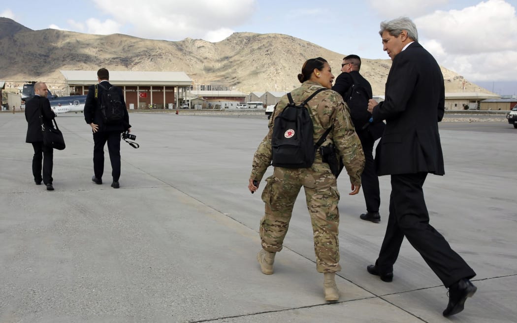 US Secretary of State John Kerry with officials in Afghanistan.