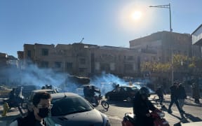 Shopkeepers and traders protest in the street against the economic conditions and Iran's embattled currency in Tehran on December 29, 2025. Some shopkeepers in Tehran closed their stores on December 29 in protest against economic hardships and sharp swings in Iran's embattled currency, Iranian media reported, following similar demonstrations a day earlier. Iran's currency has hit new lows on the unofficial market, with the US dollar trading at around 1.42 million rials on Sunday, compared to 820,000 rials a year ago and the euro nearing 1.7 million rials, according to price monitoring websites. (Photo by HANDOUT / FARS NEWS AGENCY / AFP)
