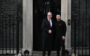Ukraine's President Volodymyr Zelensky (R) shakes hands with Britain's Prime Minister Keir Starmer upon arrival to attend a bilateral meeting in central London on 1 March, 2025 ahead of a European leader's summit the following day. The UK Prime Minister on February 28 vowed "unwavering support" for Ukraine following the breakdown in talks between Zelensky and US President Donald Trump, which saw in front of US and international media, Trump and Vice President JD Vance shouting at Zelensky, accusing him of not being "thankful" and refusing to accept their proposed truce terms. (Photo by Ben STANSALL / AFP)