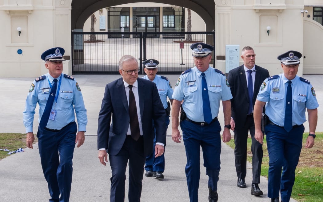 Alongside police, Australian Prime Minister Anthony Albanese has laid flowers at the scene of a deadly terrorist attack at Sydney's Bondi Beach which occurred on 14 December 2025.