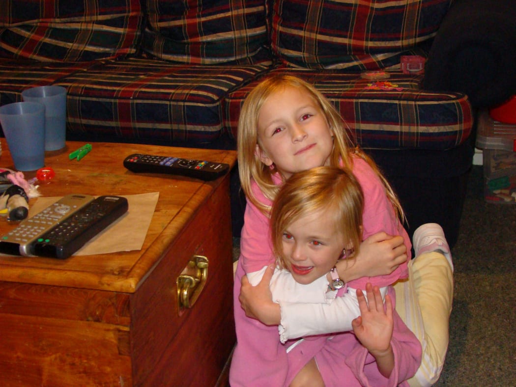 Ashley Cullen and her little sister Phie shortly after the 2010 Christchurch earthquake.