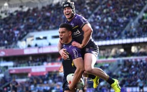 William Warbrick of the Storm (left) celebrates scoring a try with Harry Grant of the Storm during the NRL qualifying final match between the Melbourne Storm and the Cronulla Sharks at AAMI Park Saturday, September 14, 2024. (AAP Image/Joel Carrett / www.photosport.nz).