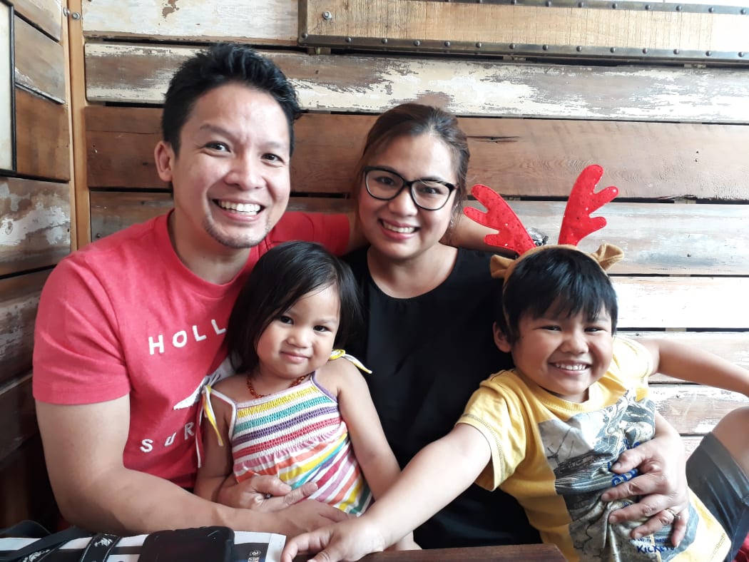 Filipino migrant Jerome Isidro and family