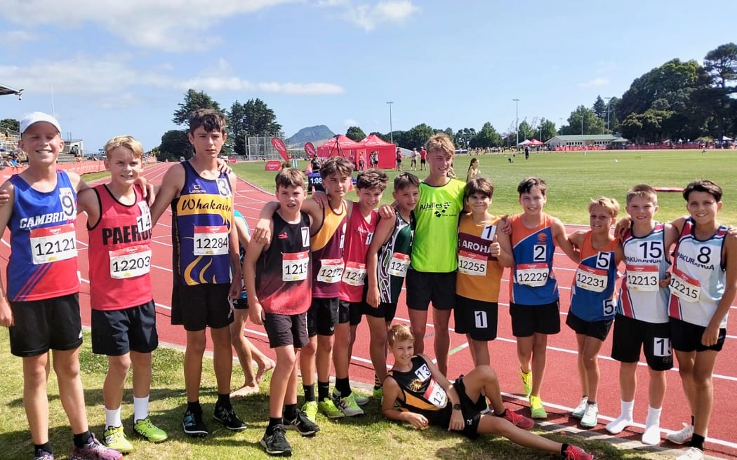 Sam Ruthe (in green) meets young fans at the Colgate Games.