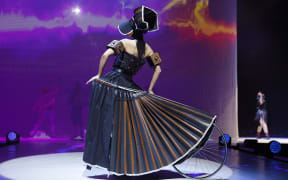 Wanton Widow by Kate MacKenzie of New Zealand is modelled in the Open Section during the 2022 World of WearableArt Preview Show at TSB Bank Arena