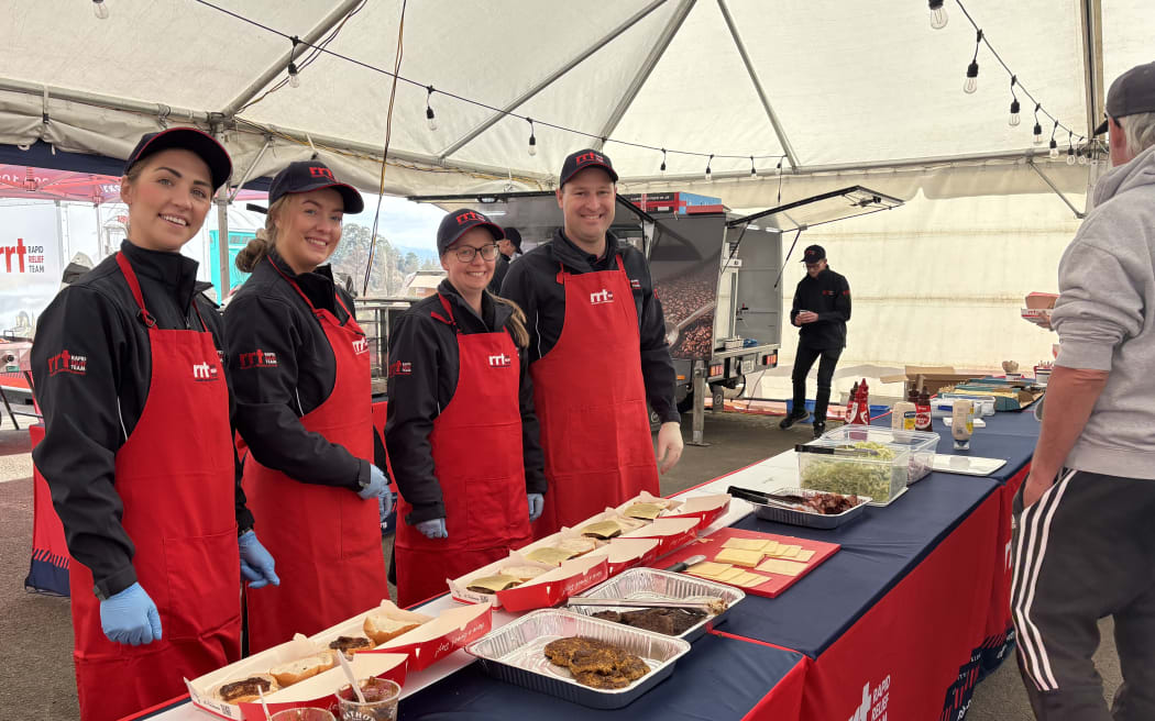 Rapid Relief Team volunteers on the burger bar at the Tapawera Farmers Community Connect event.