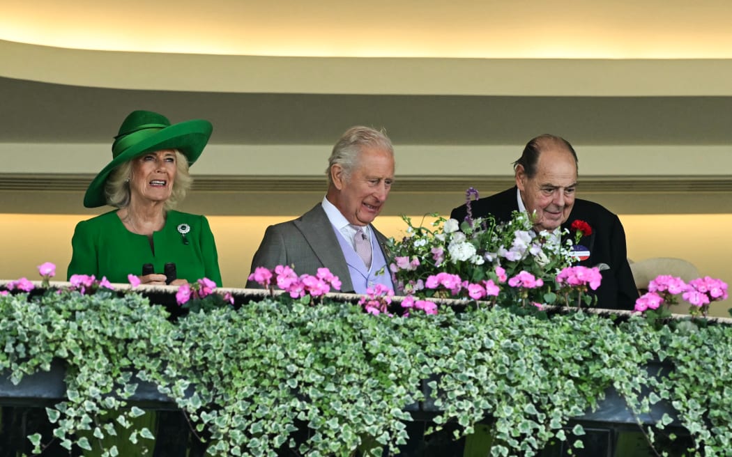 (From L) Britain's Queen Camilla, Britain's King Charles III and member of the house of Lords and Winston Churchill's grandson Nicholas Soames watch the horse races on the second day of the Royal Ascot horse racing meeting in Ascot, west of London, on June 18, 2025.