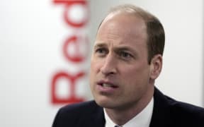Britain's Prince William, Prince of Wales reacts during a visit to the British Red Cross' headquarters in London on February 20, 2024. The Prince of Wales visit the British Red Cross to hear about the humanitarian efforts taking place to support those affected by the conflict in Middle East and in Gaza. (Photo by Kin Cheung / POOL / AFP)