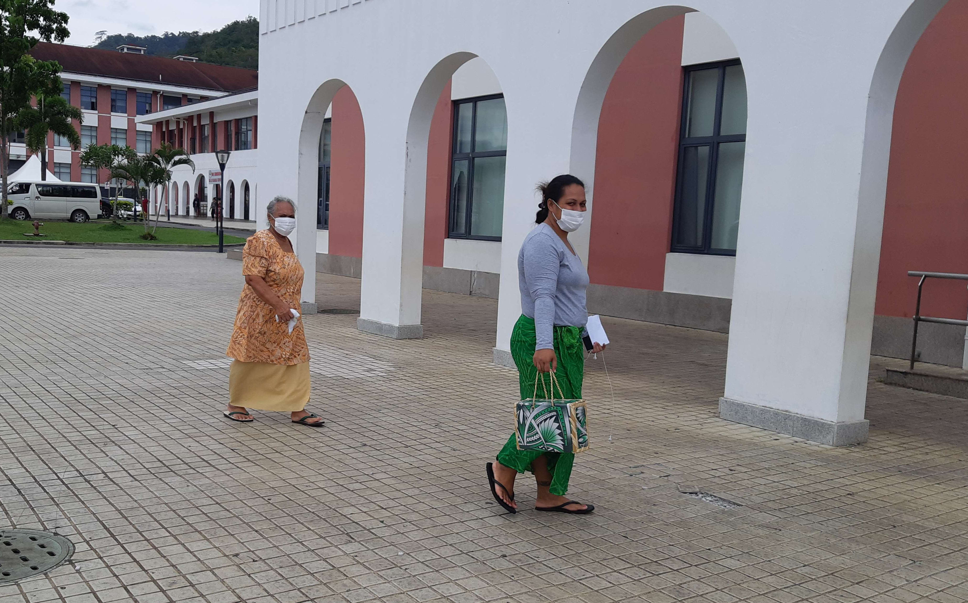 Women in Samoa wearing masks to protect themselves from measles.