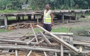 A Solomon Islands Red Cross worker surveys damage following the 7.8 magnitude earthquake on 9 December 2016