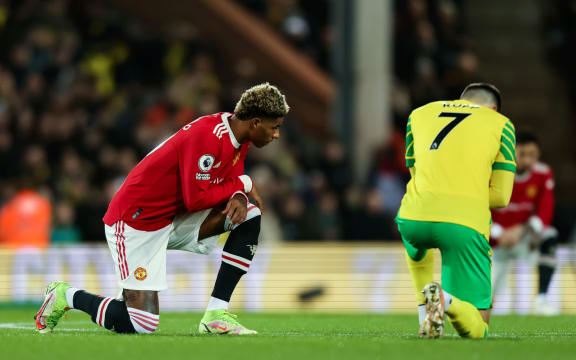 Marcus Rashford of Manchester United takes a knee