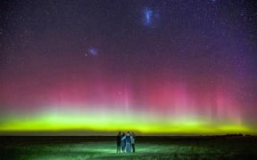 Mark Takerei and his family watch the Aurora Australis near Motukarara, south of Christchurch.