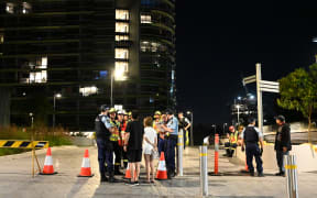 Australian police evacuated thousands of people in west Sydney late Christmas Eve, after residents reported hearing a "loud crack" from a 38-storey building.