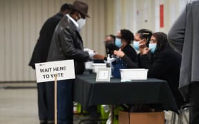 ATLANTA, GEORGIA - OCTOBER 15: People sign in to cast their votes on the first day of early voting at East Point First Mallalieu United Methodist Church on October 15, 2024 in Atlanta, Georgia. Early voting takes place from October 15 - November 1, ahead of Election Day on November 5.   Megan Varner/Getty Images/AFP (Photo by Megan Varner / GETTY IMAGES NORTH AMERICA / Getty Images via AFP)