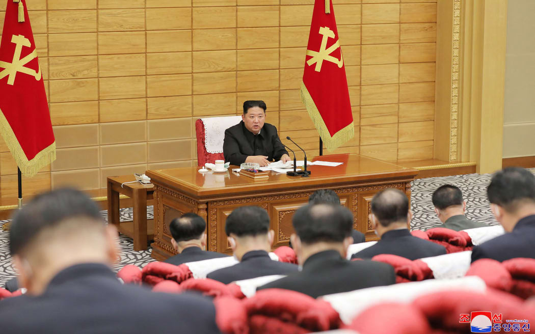 North Korean leader Kim Jong Un takes part in an emergency Workers' Party of Korea meeting to discuss measures to mitigate the spread of Covid-19 in the country.
