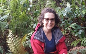 Our Changing World producer Alison Ballance helping check stoats traps in Fiordland.