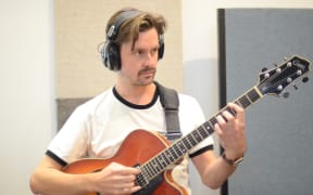 Guitarist Peter Koopman playing his instrument