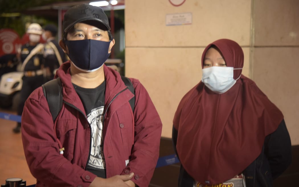TANGGERANG, INDONESIA - JANUARY 9: Efta Kurniawan (L), a relative of the victim of a Sriwijaya Air passenger with flight number SJ 182 crashed into the sea is seen at Soekarno Hatta Airport, Indonesia on January 9, 2021.