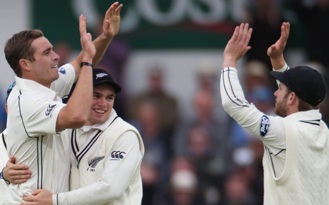 The New Zealand bowler Tim Southee (left) celebrates taking wicket.
