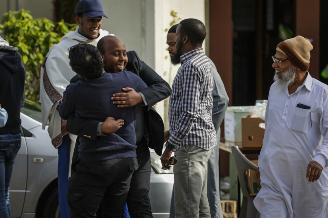 Worshippers greet one another at Al Noor mosque in the first Friday prayers since the Christchurch mosque shooter's sentencing.