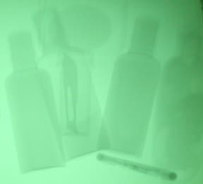 X-ray image of toiletries with hidden scalpel