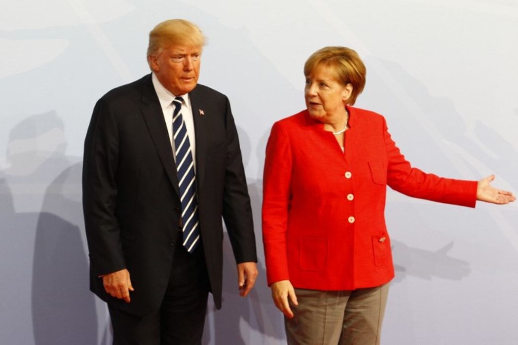 German Chancellor Angela Merkel welcomes US President Donald Trump during G20 Leaders' Summit in Hamburg.