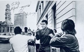 Muhammad Ali sparring with a couple lads on Queen St in 1979