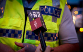 Adriana Weber interviewing an officer about drink driving.