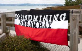 No Sand Mining Bream Bay protest banner hangs at Ruakaka Beach