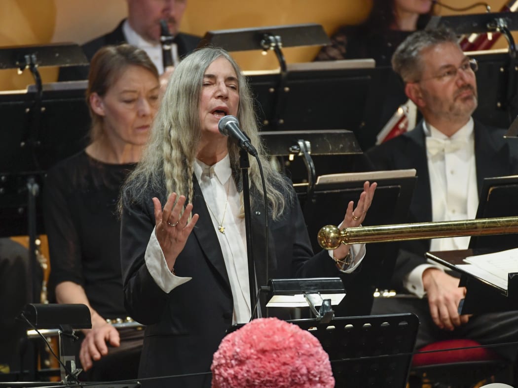 US singer Patti Smith performs "A Hard Rain's A-Gonna Fall" by absent literature prize winner Bob Dylan, at the ceremony in Stockholm.