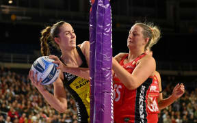 Kelly Jackson of the Central Pulse and Ellie Bird of the Tactix tussle for the ball, 2025.