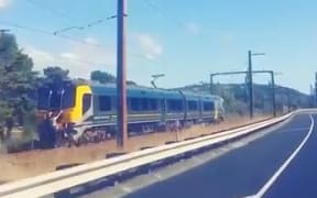 A screenshot from a video showing train-surfing in Wellington.